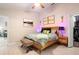 Comfortable main bedroom with natural light, wood-look floors and a spacious closet at 1848 Jimson Ave, Ocoee, FL 34761