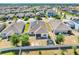 Aerial view of backyard with trampoline and a full view of solar panels at 210 Hydra Way, Groveland, FL 34736