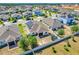 Aerial view of fenced in yard with trampoline and solar panels at 210 Hydra Way, Groveland, FL 34736