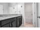 Bathroom featuring a dual vanity, granite countertops, and a bath and shower combo at 210 Hydra Way, Groveland, FL 34736