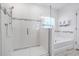 Bathroom featuring a walk-in shower, soaking tub, and modern fixtures at 210 Hydra Way, Groveland, FL 34736