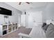 Well-lit bedroom with a ceiling fan, built-in storage, and easy access to the ensuite bathroom and closet at 210 Hydra Way, Groveland, FL 34736