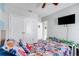 Playful bedroom with a ceiling fan and ample space for activities, creating a fun and functional environment at 210 Hydra Way, Groveland, FL 34736