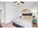 Comfortable bedroom with neutral carpet, ceiling fan, and double door closet for storage, offering a peaceful retreat at 210 Hydra Way, Groveland, FL 34736