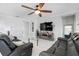 Inviting living room with bright natural light, a ceiling fan, and comfortable seating, perfect for relaxing or entertaining at 210 Hydra Way, Groveland, FL 34736