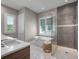 Spa-like bathroom with a soaking tub, a glass enclosed shower, and dual sinks at 2171 Forrest Rd, Winter Park, FL 32789