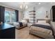 Bedroom with wood flooring, stylish chandelier, two twin beds and great natural light at 2171 Forrest Rd, Winter Park, FL 32789