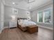Serene bedroom featuring natural light, hardwood floors, and neutral tones at 2171 Forrest Rd, Winter Park, FL 32789