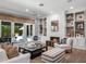 Cozy living room featuring a fireplace and built-in shelving at 2171 Forrest Rd, Winter Park, FL 32789
