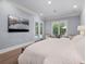 Tranquil main bedroom with private balcony access, recessed lighting, and hardwood floors at 2171 Forrest Rd, Winter Park, FL 32789