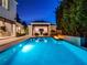 Backyard pool with built-in fire feature and covered patio for luxurious outdoor living and entertaining at 2171 Forrest Rd, Winter Park, FL 32789
