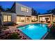 Back of home showcasing the beautiful backyard pool and lounge area for relaxing evenings and entertaining guests at 2171 Forrest Rd, Winter Park, FL 32789