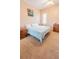 Bedroom features carpeted floors and a sunny window at 225 Loma Del Sol Dr, Davenport, FL 33896