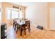 Sunlit dining room featuring tile flooring, a bay window, and chandelier lighting at 225 Loma Del Sol Dr, Davenport, FL 33896