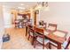 Open concept dining room and kitchen with tiled floor and bar stool seating at 225 Loma Del Sol Dr, Davenport, FL 33896