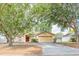 Charming single-story home featuring mature trees and a well-maintained front yard at 225 Loma Del Sol Dr, Davenport, FL 33896