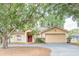 Inviting single-story home with a classic design and a spacious driveway at 225 Loma Del Sol Dr, Davenport, FL 33896