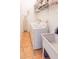 Functional laundry room with washer, dryer, utility sink, and ample storage and counter space at 225 Loma Del Sol Dr, Davenport, FL 33896