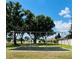 Neighborhood playground with swings set nestled amongst mature trees at 225 Loma Del Sol Dr, Davenport, FL 33896