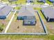 Aerial view of the fenced backyard featuring an enclosed pool area and view of the neighborhood at 236 Aquamarine Ln, Kissimmee, FL 34758