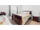 Bedroom with a bed, carpet flooring, and window with curtains at 236 Aquamarine Ln, Kissimmee, FL 34758