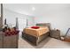 Bedroom featuring neutral decor, a large bed, and carpet flooring at 236 Aquamarine Ln, Kissimmee, FL 34758
