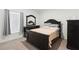 Bedroom with a bed, carpet flooring, and window with blinds at 236 Aquamarine Ln, Kissimmee, FL 34758