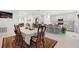 Dining room showcasing an open floor plan, flowing into the kitchen with gray cabinets at 236 Aquamarine Ln, Kissimmee, FL 34758