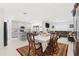 Open-concept dining area flowing into the kitchen and living room space at 236 Aquamarine Ln, Kissimmee, FL 34758