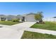 A well-maintained single Gathering home featuring a two car garage and lawn at 236 Aquamarine Ln, Kissimmee, FL 34758
