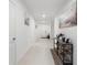Hallway featuring tile floors, artwork, and decor at 236 Aquamarine Ln, Kissimmee, FL 34758