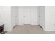 Hallway showcasing tile flooring and three doors at 236 Aquamarine Ln, Kissimmee, FL 34758