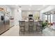 Modern kitchen with stainless appliances, an island, and light-gray cabinets at 236 Aquamarine Ln, Kissimmee, FL 34758