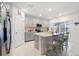 Kitchen showcasing a center island and stainless steel appliances at 236 Aquamarine Ln, Kissimmee, FL 34758