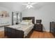 Traditional Bedroom with hard wood floors, ceiling fan, and windows with stylish curtains at 24 W King St, Orlando, FL 32804