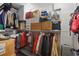 Walk-in Closet loaded with seasonal clothing and storage boxes. Lots of shelving for organization at 24 W King St, Orlando, FL 32804