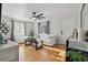 Bright living room boasts hardwood floors, stylish furniture, and a large ceiling fan at 24 W King St, Orlando, FL 32804