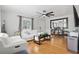 Bright living room boasts hardwood floors, stylish furniture, and a large mirror at 24 W King St, Orlando, FL 32804