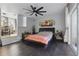 Spacious main bedroom with dark wood floors, large closet and a sliding glass door to the exterior at 24 W King St, Orlando, FL 32804