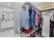 Walk-in Closet located off of the bathroom features a double vanity with black fixtures and lots of hanging storage at 24 W King St, Orlando, FL 32804