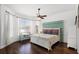 Bright bedroom with a bay window, hardwood floors, and decorative headboard at 2424 Antlia Dr, Orlando, FL 32828
