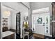 Bright foyer featuring elegant details, transom window, and dark wood floors at 2424 Antlia Dr, Orlando, FL 32828