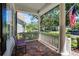 Relaxing front porch with brick pavers, white railing, columns, and a view of the neighborhood at 2424 Antlia Dr, Orlando, FL 32828