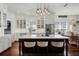 Modern kitchen with white cabinetry, stainless steel appliances, and a large center island with seating at 2424 Antlia Dr, Orlando, FL 32828