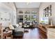Spacious living room featuring vaulted ceilings, hardwood floors, and ample natural light at 2424 Antlia Dr, Orlando, FL 32828