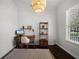 Well-lit office space featuring a desk, natural light, and hardwood floors at 2424 Antlia Dr, Orlando, FL 32828