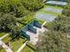 Community racquetball court surrounded by mature trees and manicured landscaping at 2424 Antlia Dr, Orlando, FL 32828