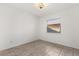 Bright bedroom with a window, tiled floor, neutral paint and ceiling light fixture at 2623 Parsley Dr, Orlando, FL 32837