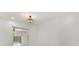 A bedroom features neutral walls and an ornate light fixture at 2623 Parsley Dr, Orlando, FL 32837