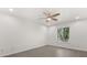 The bedroom features tile floors, a ceiling fan and a window at 2623 Parsley Dr, Orlando, FL 32837